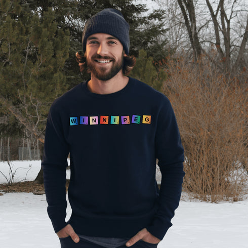 Introducing our newest addition to your wardrobe - the trendy graphic sweatshirt featuring colorful Winnipeg Scrabble Titles.